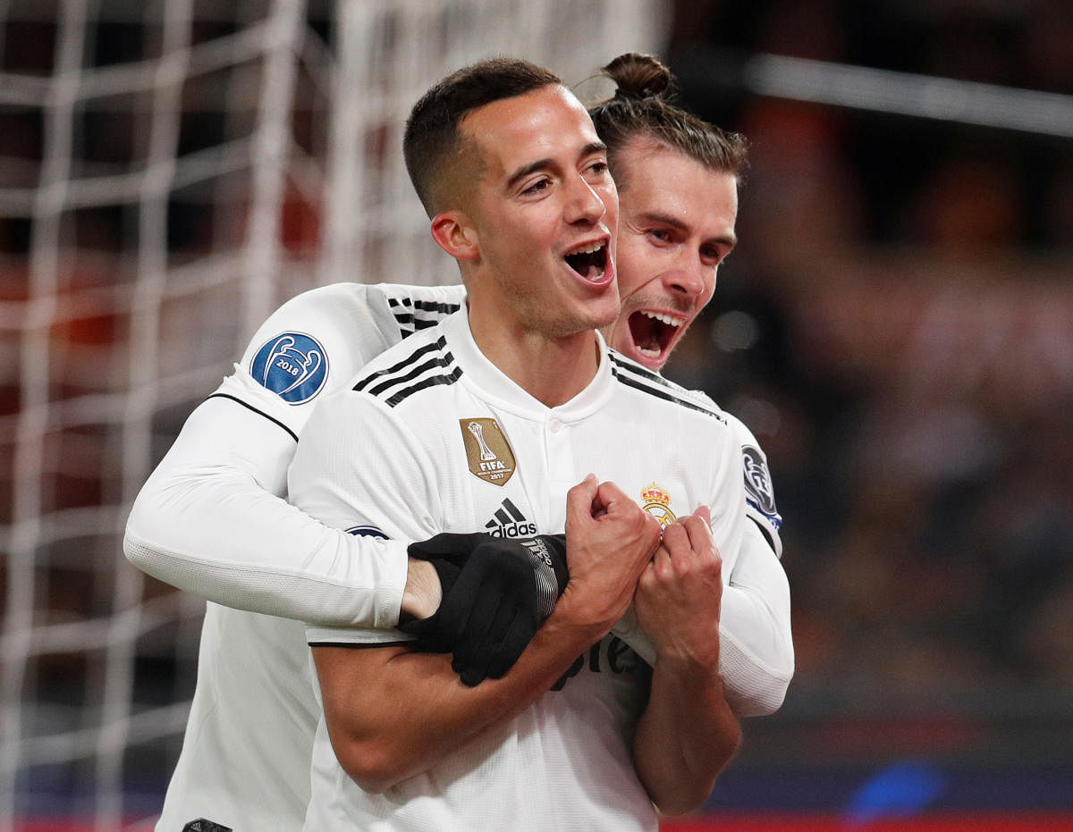 TWIN TROUBLE Real Madrid's Lucas Vazquez (front) celebrates with Gareth Bale after scoring their second goal against Roma on Tuesday. REUTERS
