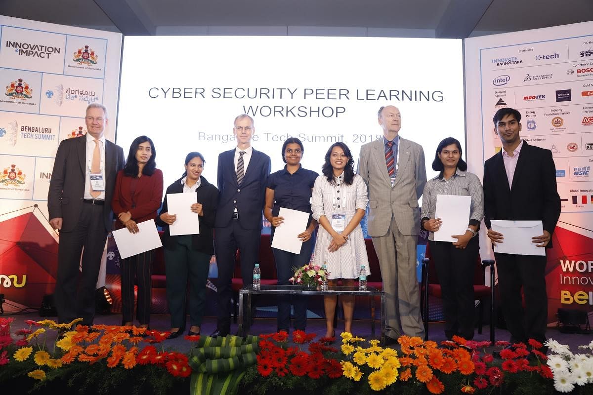 (From L to R) Deputy Director (Market and Operations), The Hague Centre for Strategic Studies Michel Rademaker, and Netherlands Ambassador for India, Nepal and Bhutan Marten Van den Berg (fourth from left), with IIIT-B students at the cybersecurity worksh