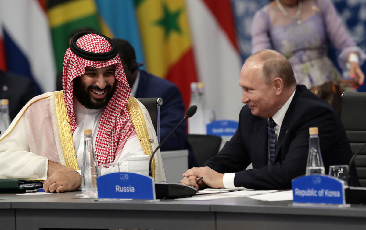 In an image that quickly went viral online, Russian President Putin and the 33-year-old prince grinned broadly and gave each other an effusive handshake as if they were long-lost friends reunited at the G20. (AFP Photo)