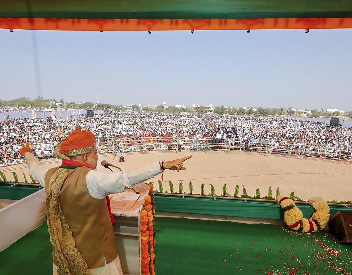 BJP National President Amit Shah addresses a public meeting, in Pahlodi of Jodhpur district, Rajasthan on Saturday. (PTI Photo)