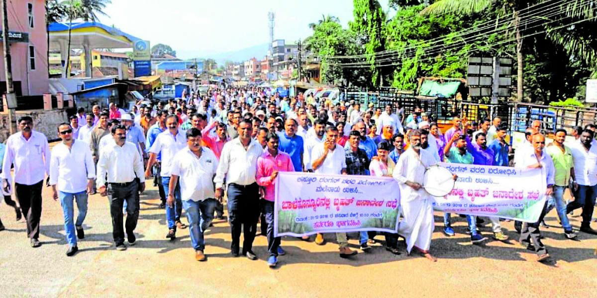 A large number of people take part in a protest against the implementation of Kasturirangan report recommendations, in Balehonnur, on Saturday.