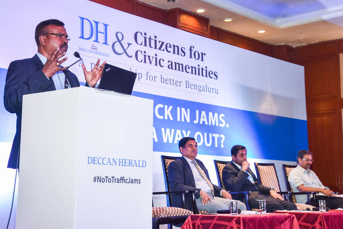 P Harishekaran, IGP and Additional Commissioner (Traffic) speaking in ‘A City Stuck in Jams, Is There A Way Out?’ Public Discussion programme organised by Deccan Hearld and Citizens for Civic amenities, A Partnership for better Bengaluru, at The Chancery Pavilion in Bengaluru on Saturday. B Basavaraaju, Principal Secretary, Transport Department, Ashish Verma, Mobility Expert, Indian Institute of Science (IISc),Vinay Sreenivasa, Advocate, Citizen Activist for Mobility, Alternative Law Forum are seen.DH Photo