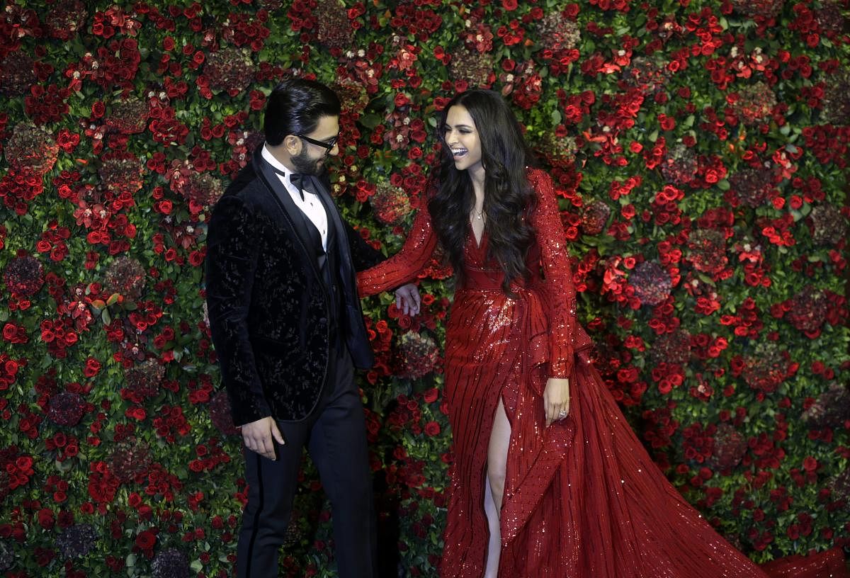 Bollywood actors Deepika Padukone, right, and Ranveer Singh at their wedding reception in Mumbai. (AP/PTI Photo)