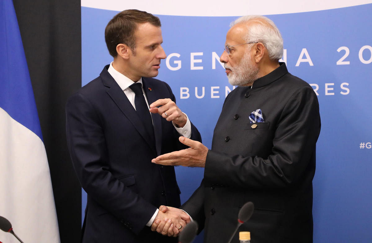 France's President Emmanuel Macron (L) and India's Prime Minister Narendra Modi speak during a bilateral meeting on the second day of the G20 Leaders' Summit in Buenos Aires, on December 01, 2018. (AFP Photo)