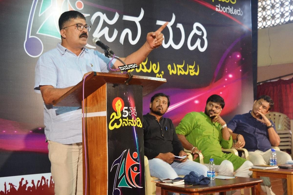 Former Bajrang Dal leader Mahendra Kumar speaks during a session in Jana Nudi convention organised by Abhimata, Mangaluru on Sunday. Sudhir Maroli and Niket Raj Mourya look on.