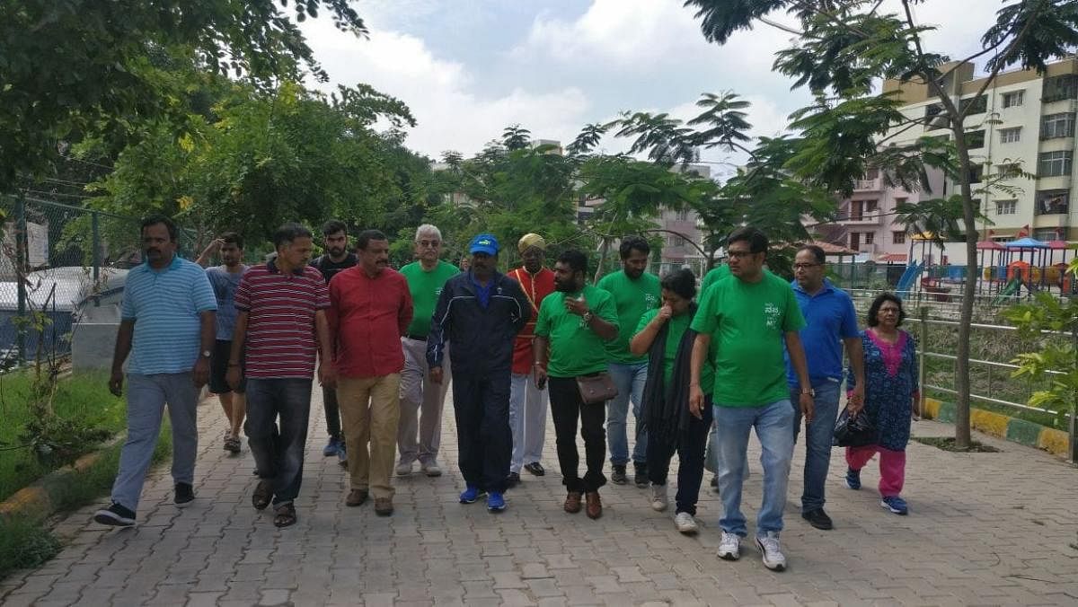 Mayor R Sampath Raj, along with the local residents, visits the Kaggadasapura Lake on Sunday.