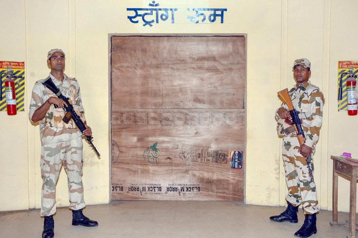Indo Tibetan Border Police Force jawans guard outside a strong room where Electronic Voting Machines (EVM) are kept, Madhya Pradesh Assembly elections, in Jabalpur, Thursday, Nov 29, 2018. (PTI Photo) 