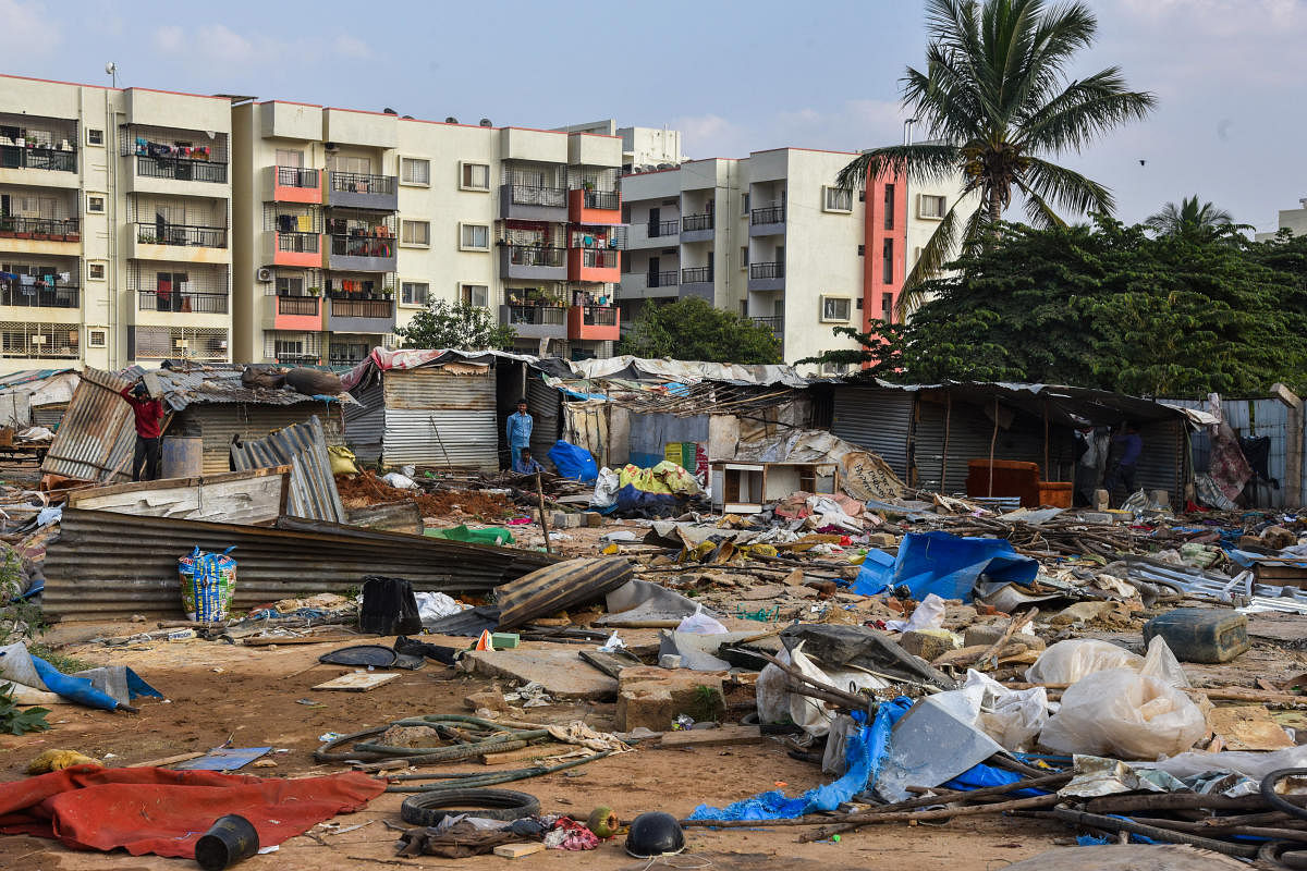 Migrant families have been living in the vacant private land for a decade. DH Photo/S K Dinesh