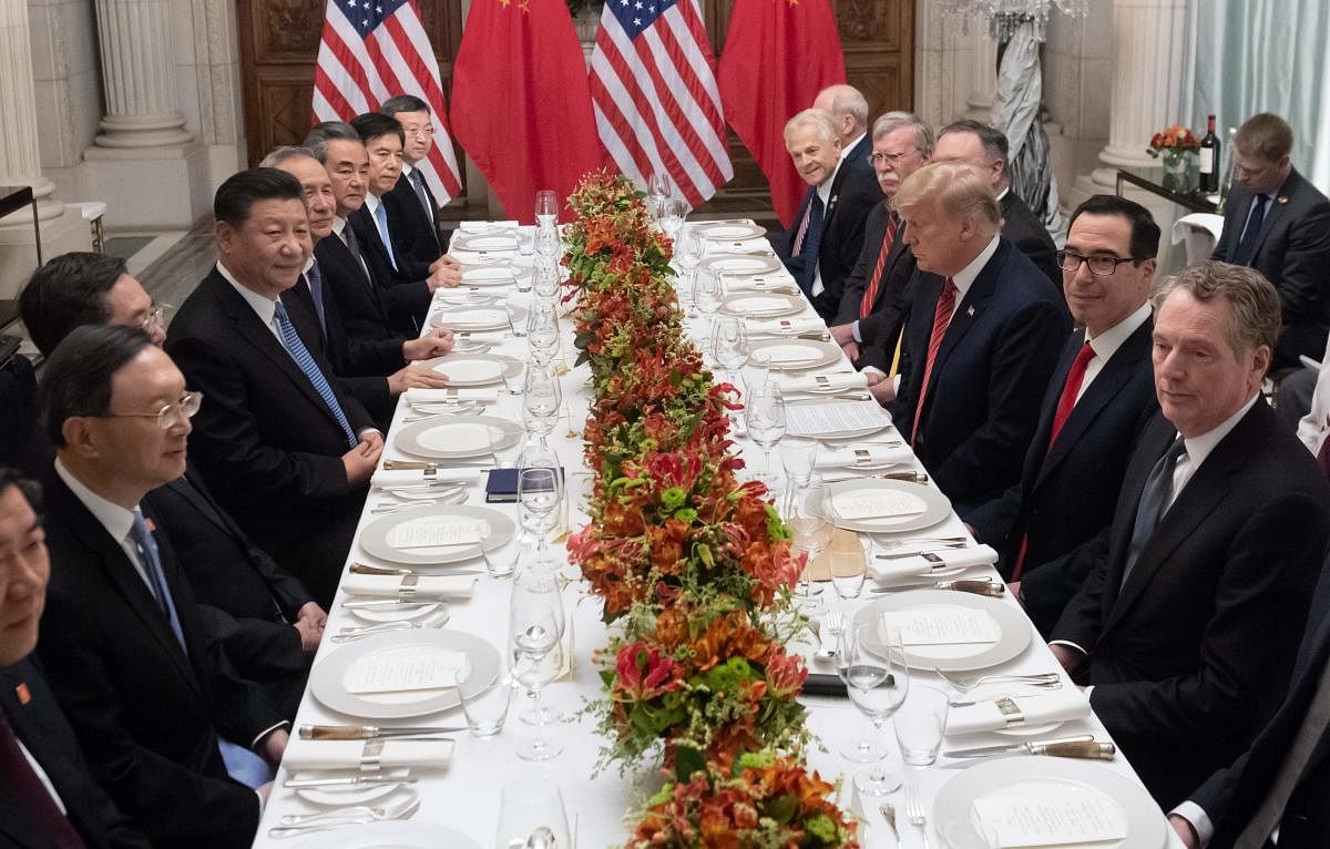 US President Donald Trump and China's President Xi Jinping along with members of their delegations, hold a dinner meeting at the end of the G20 Leaders' Summit in Buenos Aires. AFP file photo.