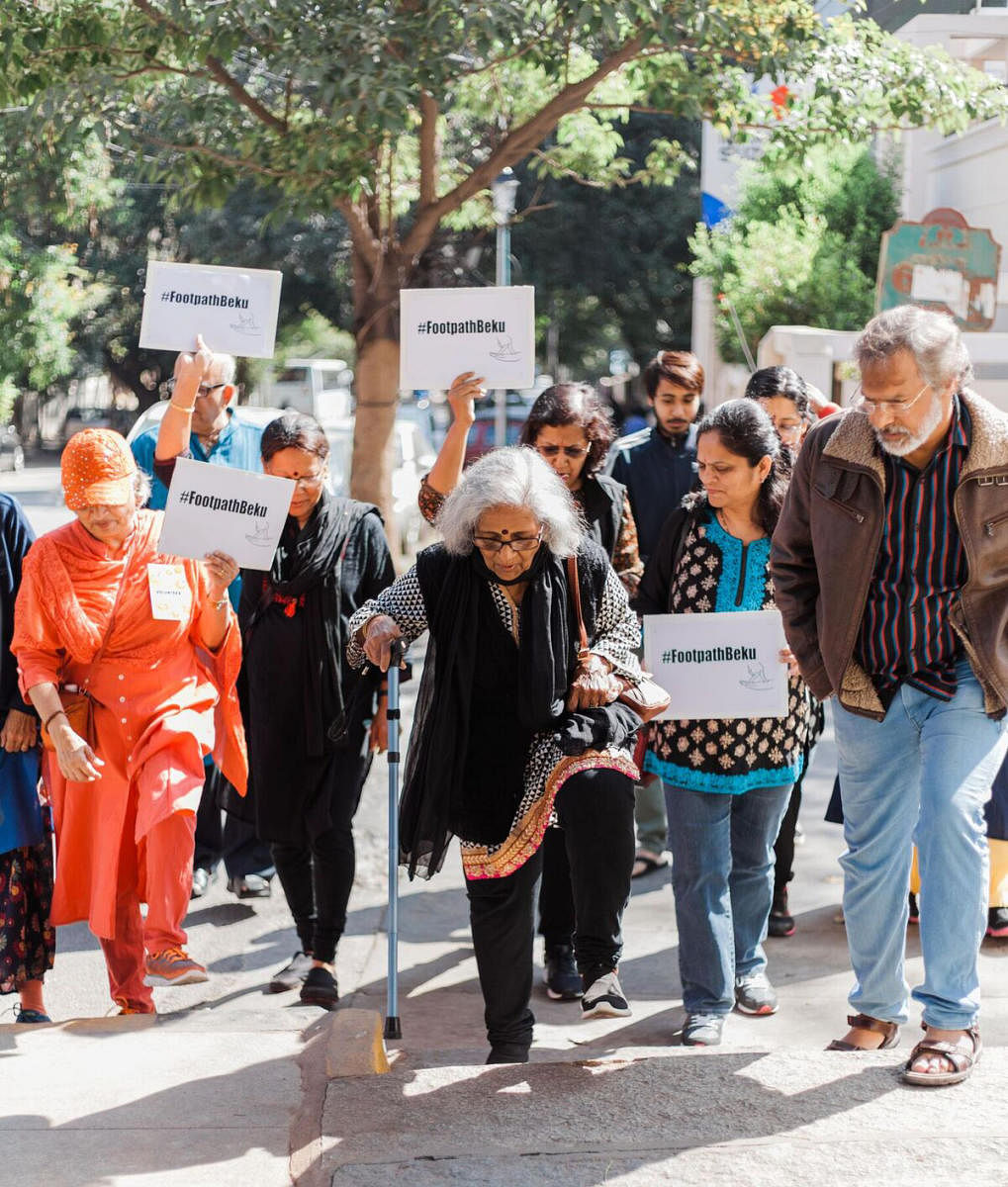Senior citizens take part in a silent march on Sunday, demanding proper footpaths in Malleswaram.