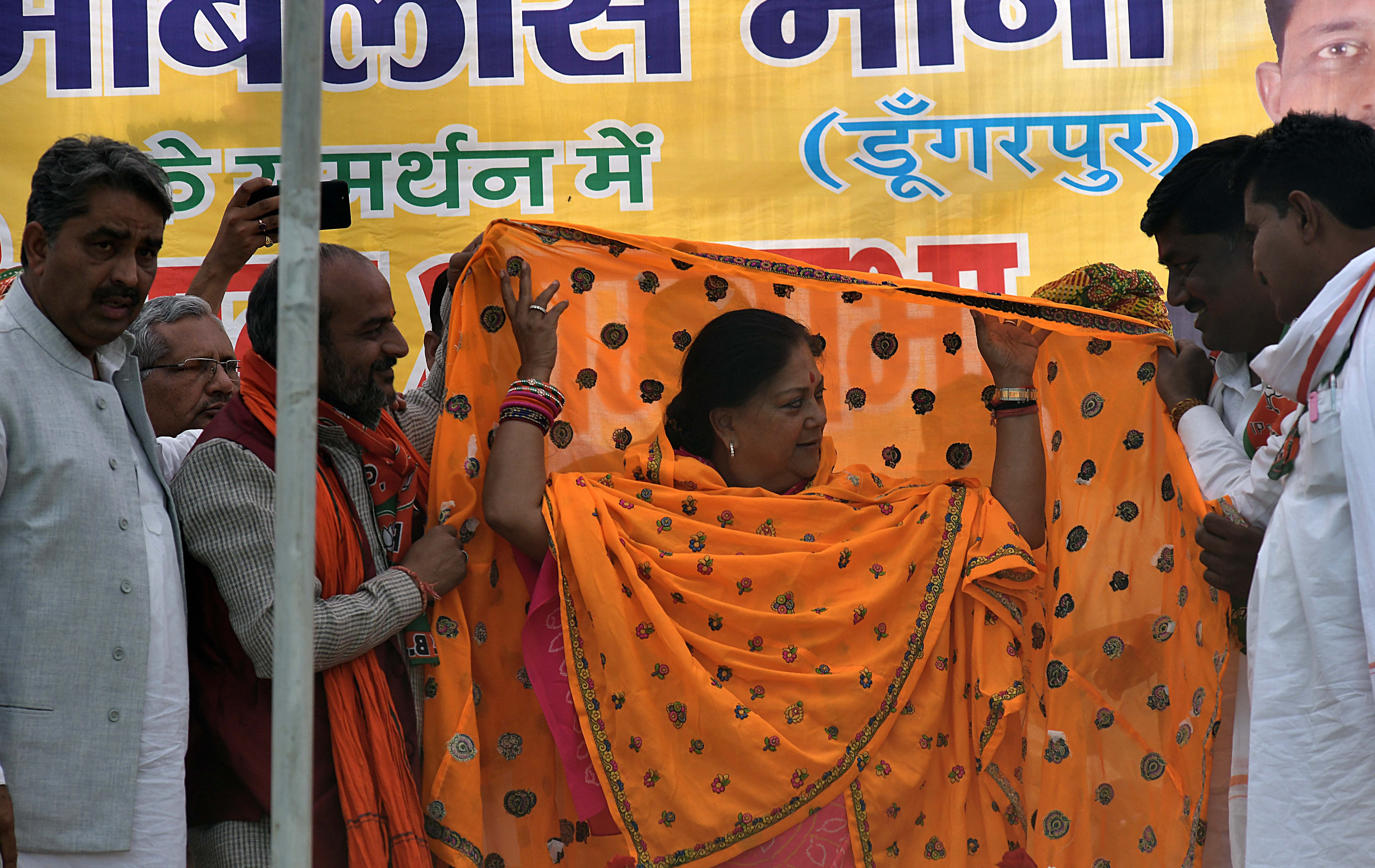Even in her campaign rally by home minister Rajnath Singh in Jhalrapatan, Raje was absent, but her supporters were showing her 'kundali' and suggesting that she would win. (Photo by Suman Sarkar)