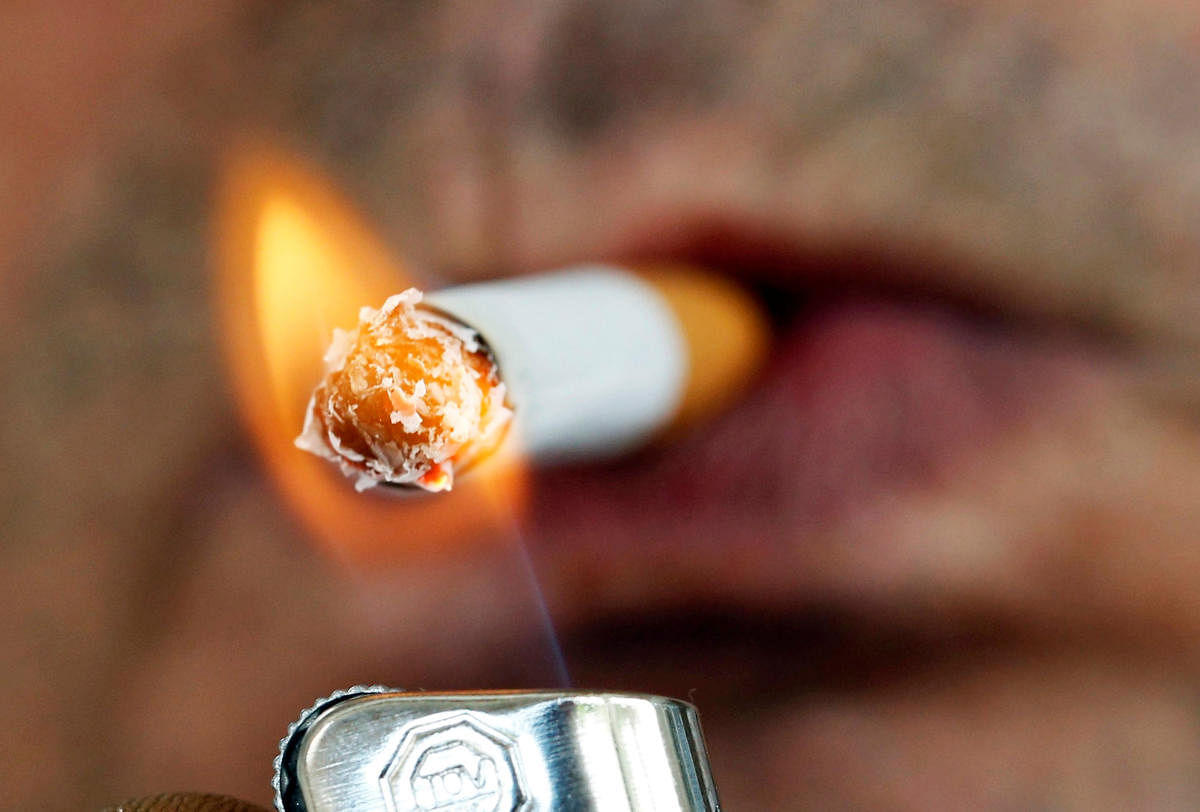 A man lights a cigarette. (Reuters file photo)