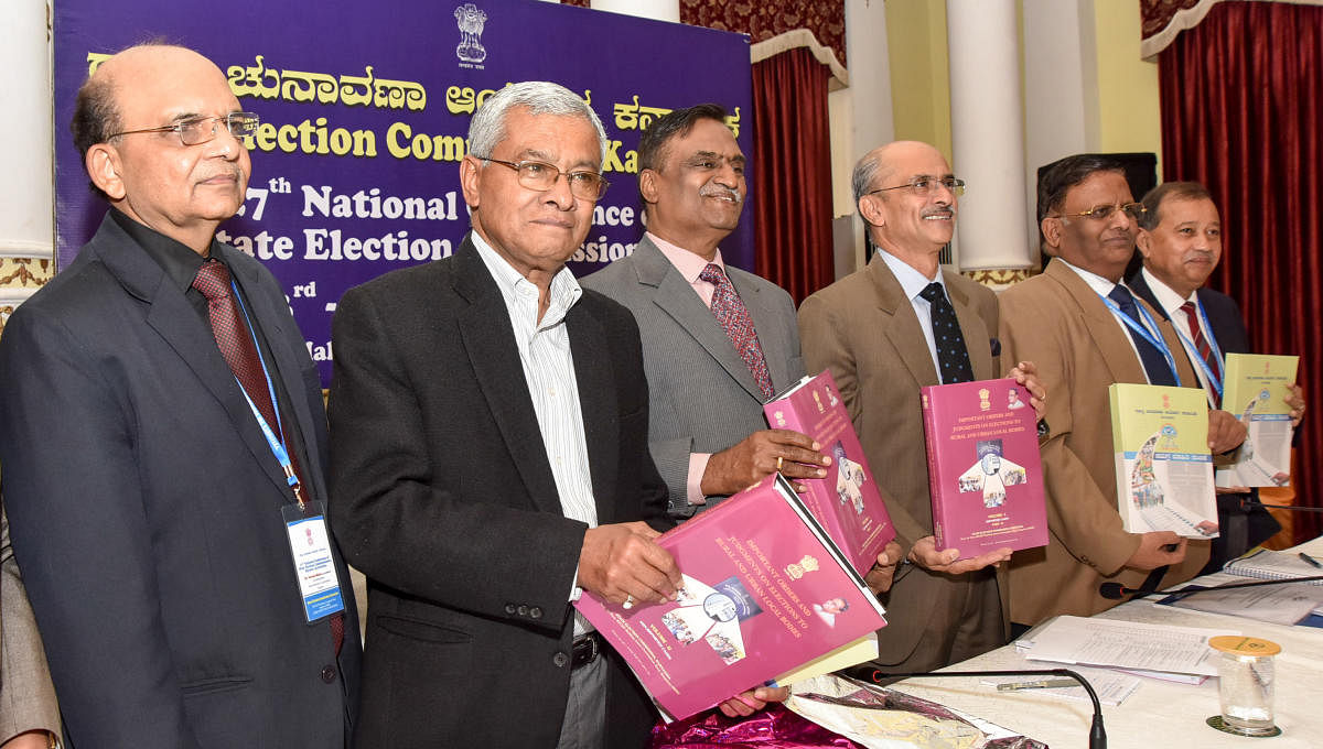 Madhya Pradesh State Election Commission Commissioner Parasuram releasing the 'Important Orders and Judgements on Elections To Rural and Urban Local Bodies' during the 27th Conference of All India State Election Commissioners Meeting, organised by Karnata