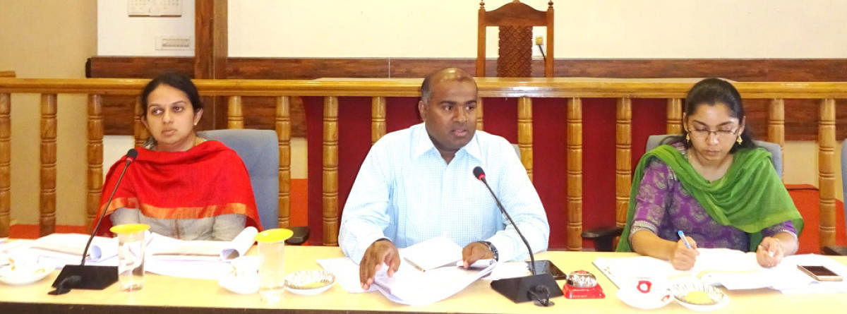 District In-charge Secretary Anbu Kumar chairs a meeting at the DC’s office in Madikeri on Tuesday. Deputy Commissioner P I Sreevidya and ZP CEO Lakshmipriya are also seen.