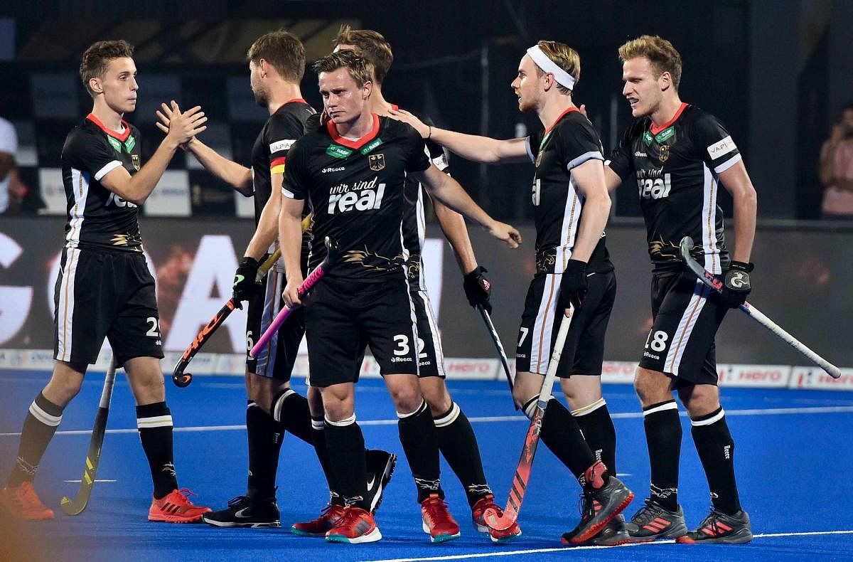 German players celebrate their win over the Netherlands in men's Hockey World Cup on Wednesday. PTI