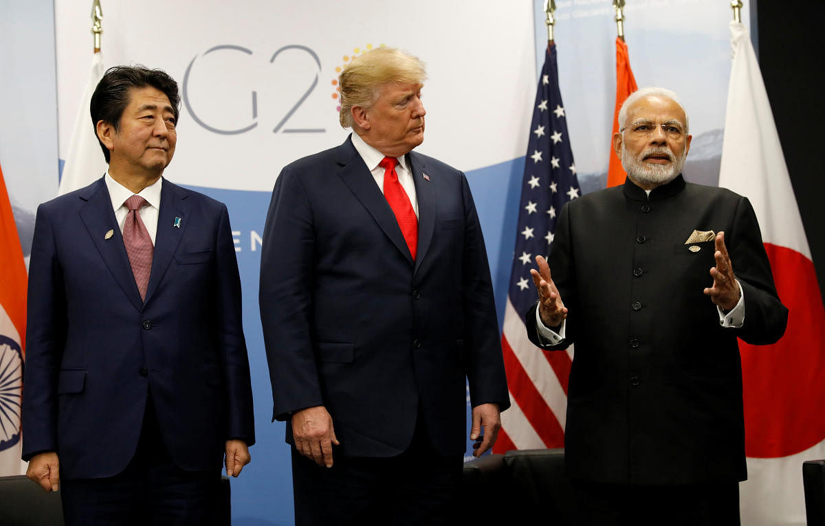 US President Donald Trump meets Japanese Prime Minister Shinzo Abe and Prime Minister Narendra Modi during the G20 leaders summit in Buenos Aires, Argentina. REUTERS