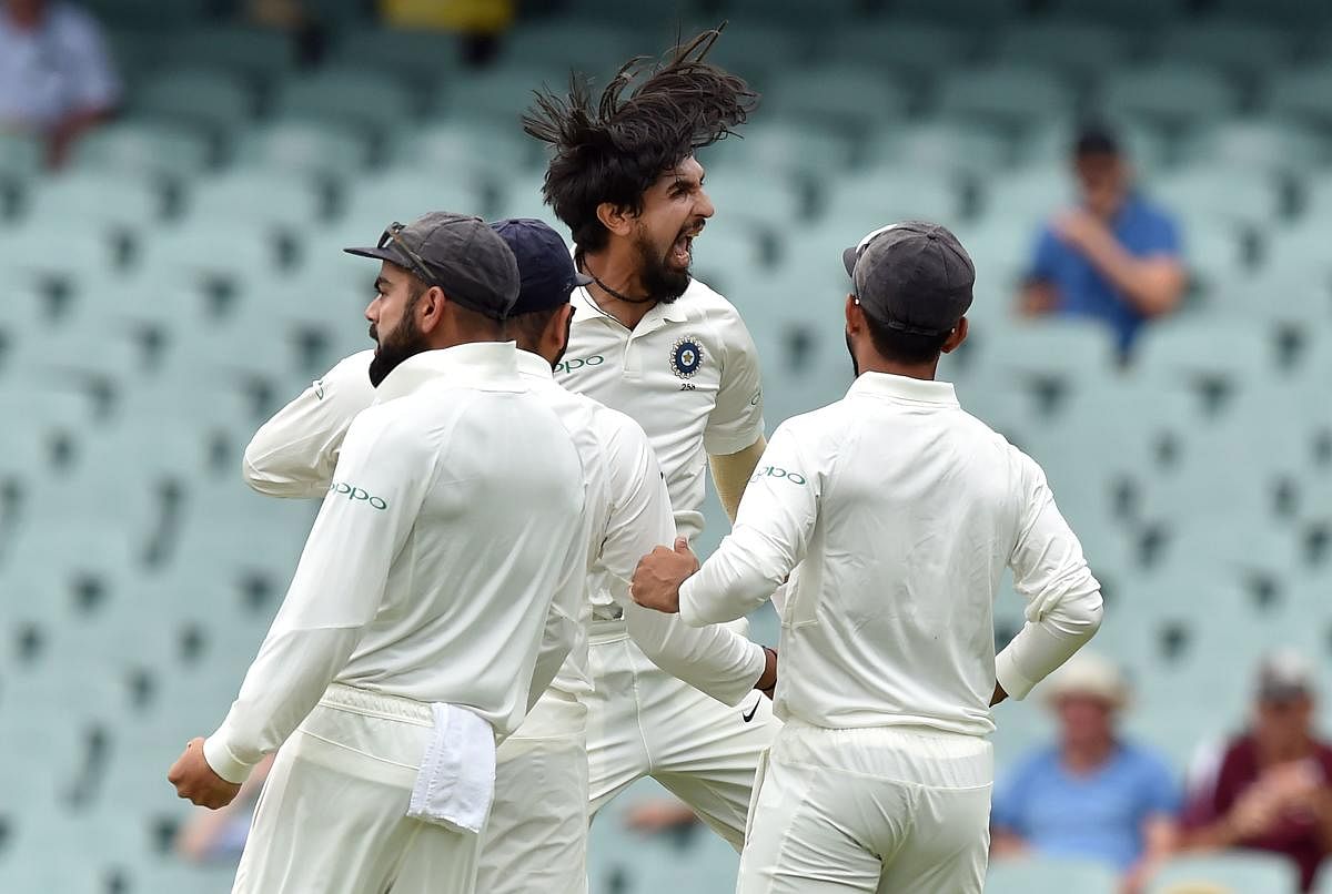 India's paceman Ishant Sharma (C) celebrates with teammates after dismissing Australia's batsman Aaron Finch during day two of the first cricket Test match at the Adelaide Oval on December 7, 2018. (AFP Photo)