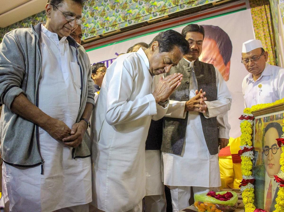 Congress State President Kamal Nath pays tribute to Bhimrao Ambedkar on his death anniversary, during a meeting of 230 Congress party candidates contesting for state Assembly election, in Bhopal, on Thursday. PTI