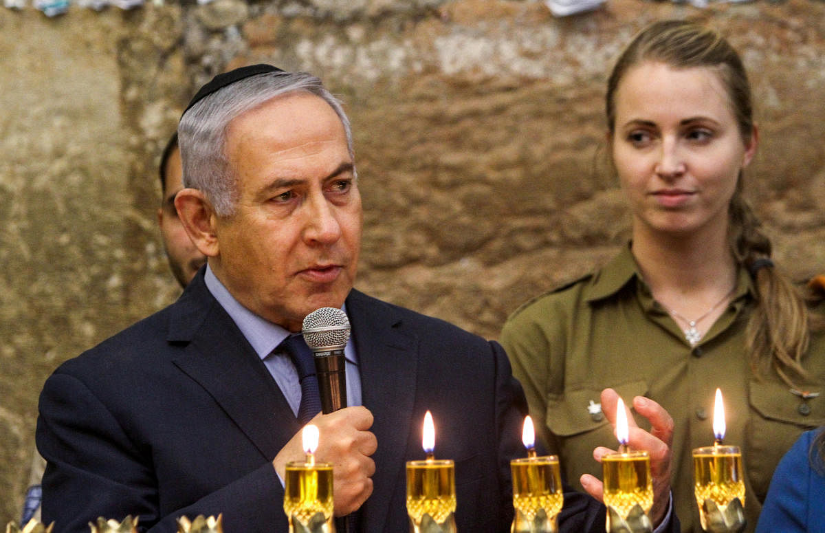 Benjamin Netanyahu speaks during a candle lightning ceremony on the Jewish holiday of Hanukkah at the Western Wall in Jerusalem's Old City. Reuters