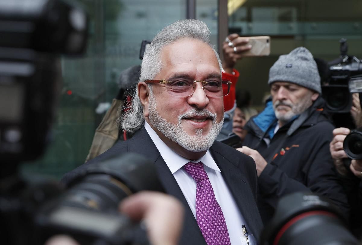 "I left India because I had a scheduled meeting in Geneva. Before leaving I met the finance minister and offered to settle (the issue with the banks), Mallya said, without naming the minister. (AP/PTI Photo)