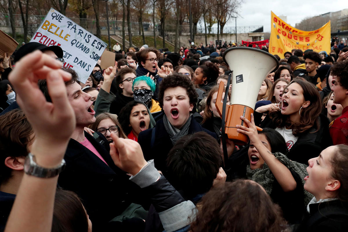 Youths and high school students attend a demonstration to protest against the French government's reform plan, in Paris, France, December 7, 2018. (REUTERS)