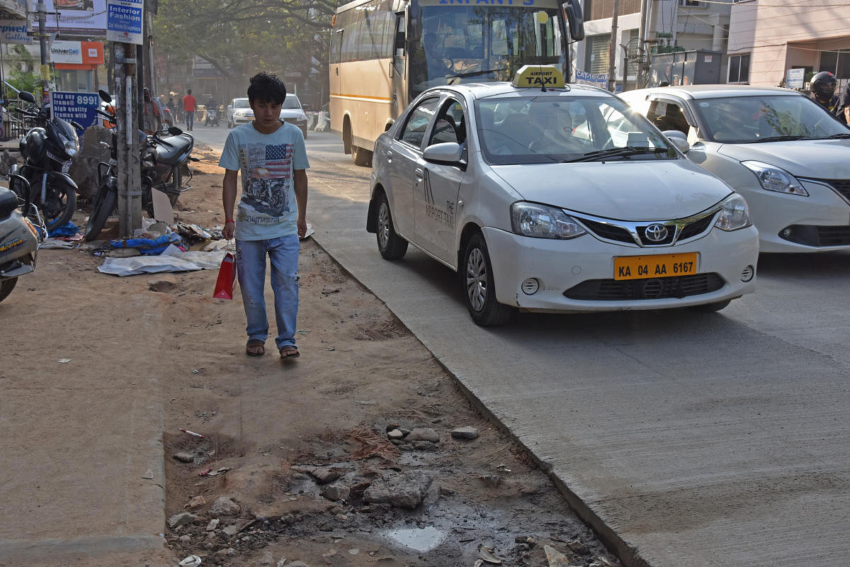 Foot path is merged with road after white topping work at Koramangala in Bengaluru on Thursday. Photo by S K Dinesh