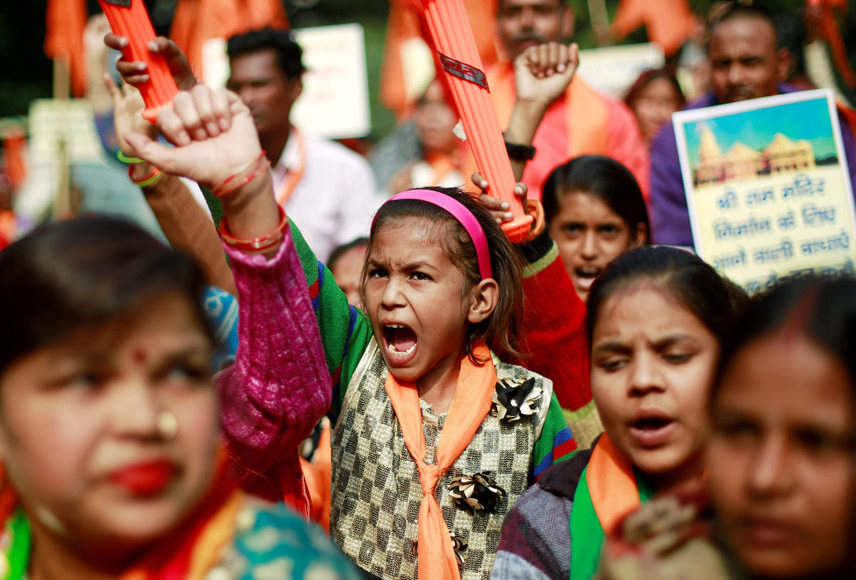People shout slogans during a demonstration organised by the Hindu hardline group "United Hindu Front" to mark the 26th anniversary of the razing of a 16th century Babri mosque by a Hindu mob in the town of Ayodhya, in New Delhi (Reuters)