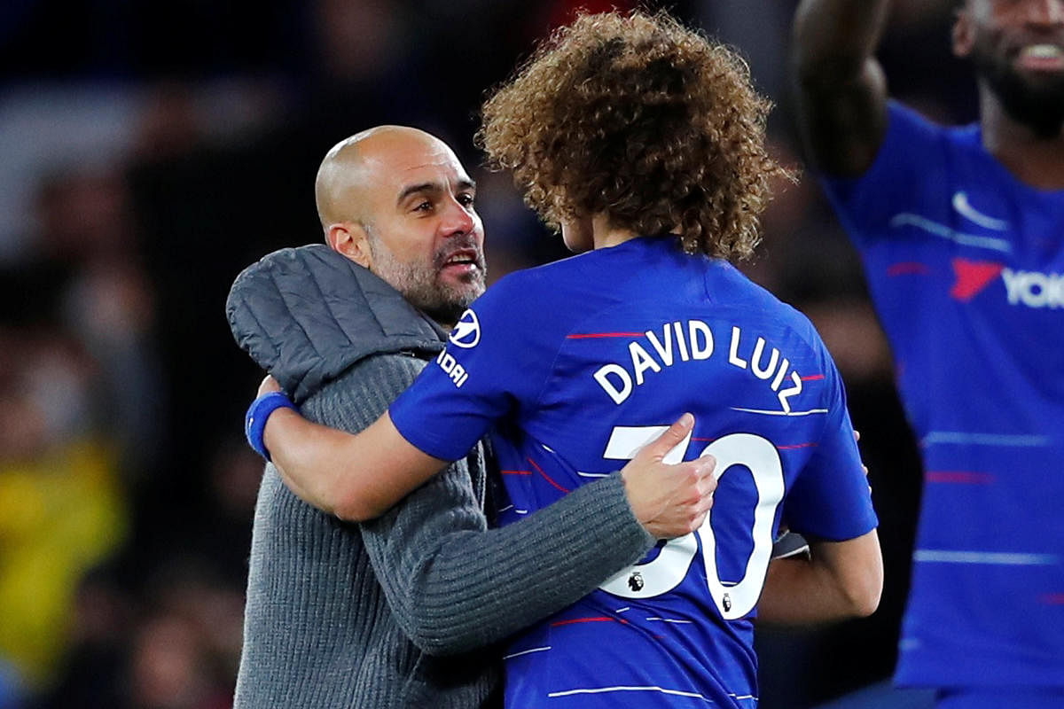 Soccer Football - Premier League - Chelsea v Manchester City - Stamford Bridge, London, Britain - December 8, 2018 Manchester City manager Pep Guardiola and Chelsea's David Luiz after the match REUTERS/Eddie Keogh EDITORIAL USE ONLY. No use with unauthori