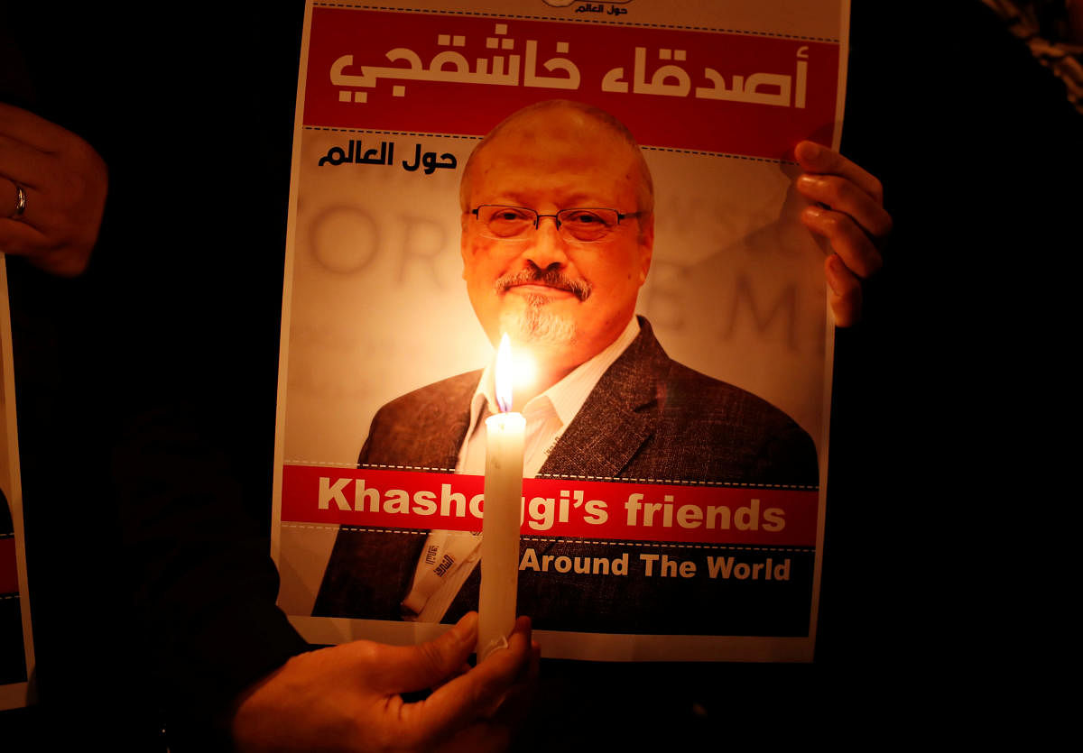 A demonstrator holds a poster with a picture of Saudi journalist Jamal Khashoggi outside the Saudi Arabia consulate in Istanbul, Turkey. (Reuters File Photo)