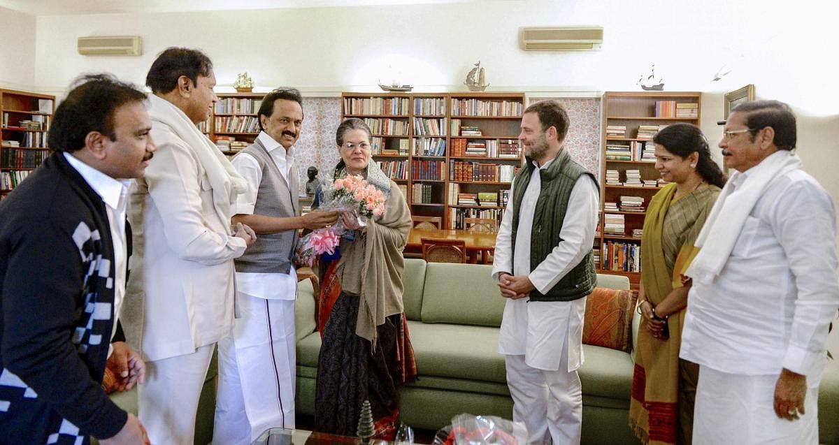 DMK President MK Stalin offers a bouquet to former Congress president Sonia Gandhi on the occasion of her birth anniversary, in New Delhi. Also seen are Congress President Rahul Gandhi, DMK leaders Kanimozhi, A Raja and others. (PTI Photo)