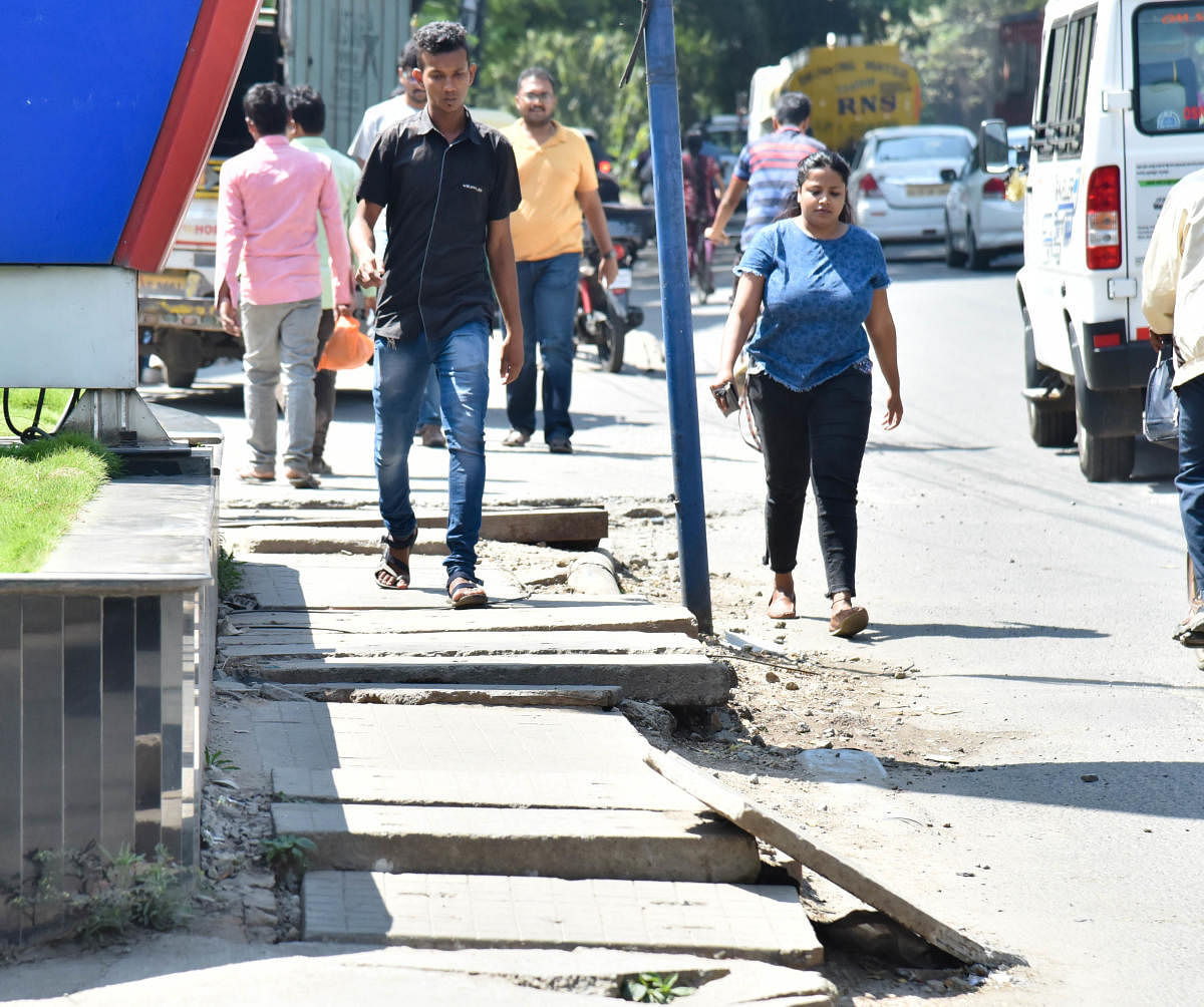 BBMP officials cited lack of funds and said the work on footpaths may not take off. DHPhoto/Janardhan B K