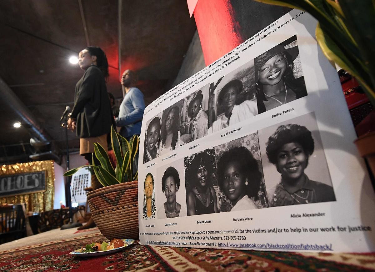 Organizers read out the names of serial killers victims of Lonnie Franklin known as the "Grim Sleeper", Samuel Little and other Los Angeles serial killers at a memorial service in Los Angeles, California on December 8, 2018. - According to the 'Black Coal
