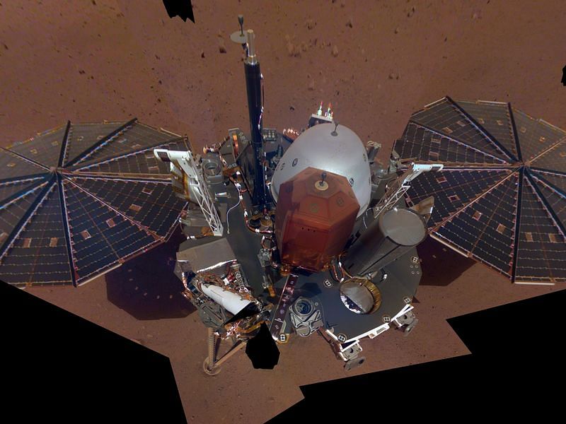 This is NASA InSight's first full selfie on Mars. It displays the lander's solar panels and deck. On top of the deck are its science instruments, weather sensor booms and UHF antenna. The selfie was taken on Dec. 6, 2018 (Sol 10). The selfie is made up of 11 images which were taken by its Instrument Deployment Camera, located on the elbow of its robotic arm. Those images are then stitched together into a mosaic.