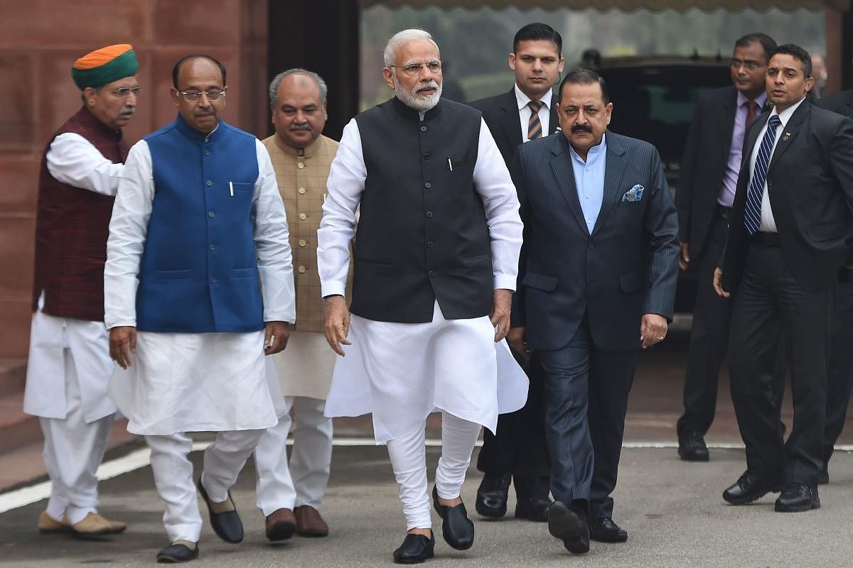 Prime Minister Narendra Modi walks upon his arrival for the winter session of parliament in New Delhi. AFP