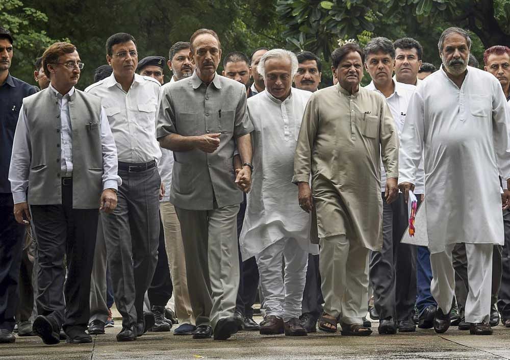 Senior Congress leaders (L-R) Vivek Tankha, Randeep Surjewala, Ghulam Nabi Azad, Jairam Ramesh, Ahmed Patel, Anand Sharma and others leave after a meeting with CVC, K V Chowdary at Central Vigilance Commission, in New Delhi. PTI Photo