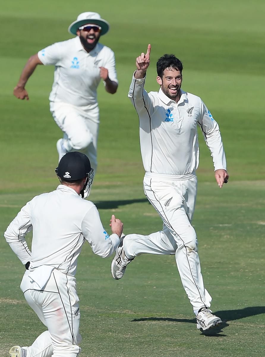 New Zealand's Will Somerville (right) celebrates with team-mates after dismissing Pakistan's Sarfraz Ahmed on Friday. AFP