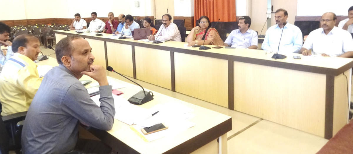 Officials take part in the tourism development committee meeting in the deputy commissioner’s office in Madikeri on Thursday.