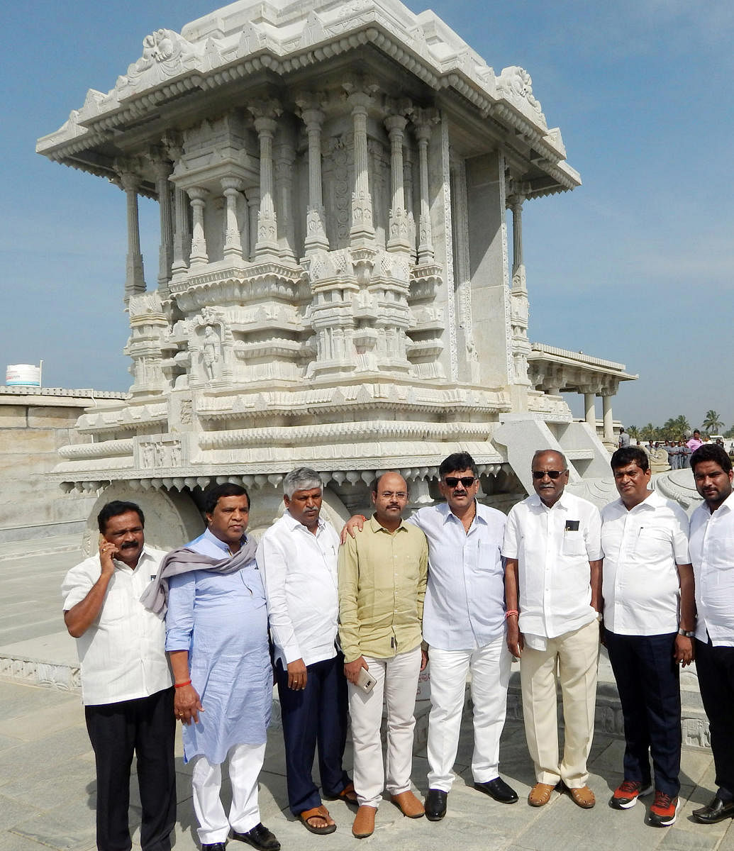 Water Resources Minister D K Shivakumar, Minor Irrigation Minister C S Puttaraju, Transport Minister D C Thammanna, MP L R Shivaramegowda, and MLAs Dr Yathindra, Anil Chikkamadu and MLCs K T Srikantegowda and N Appaji Gowda are seen in front of the stone