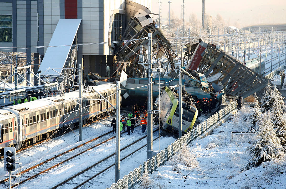 Rescue workers search at the wreckage after a high speed train crash in Ankara, Turkey. REUTERS Photo