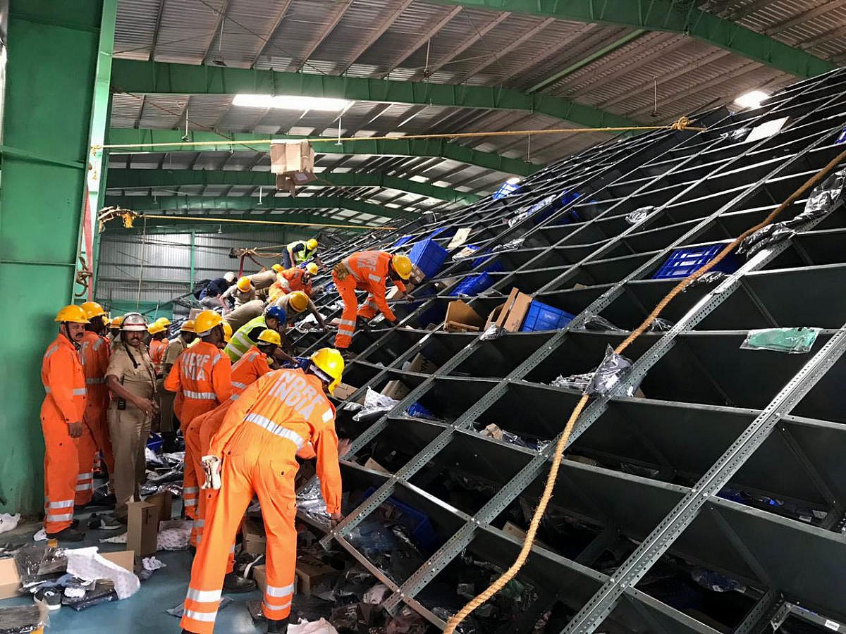 Falling racks kill three workers at warehouse