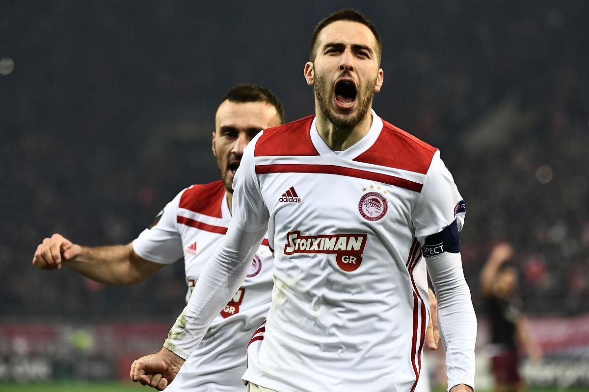 Olympiakos' Kostas Fortounis exults after scoring against AC Milan during their Europa League match on Thursday. AFP