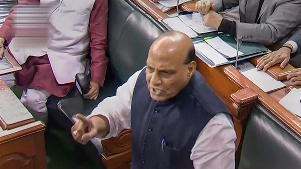 Union Home Minister Rajnath Singh speaks in the Lok Sabha during the Winter Session of Parliament, New Delhi, Friday. (PTI Photo)