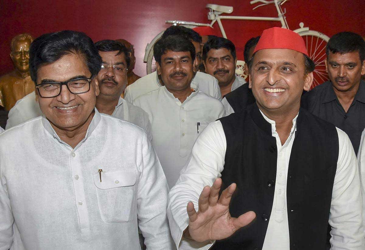 Samajwadi Party (SP) Chief Akhilesh Yadav with Party General Secretary Ram Gopal Yadav during a press conference after Uttar Pradesh by-elections results, in Lucknow on Thursday. PTI Photo