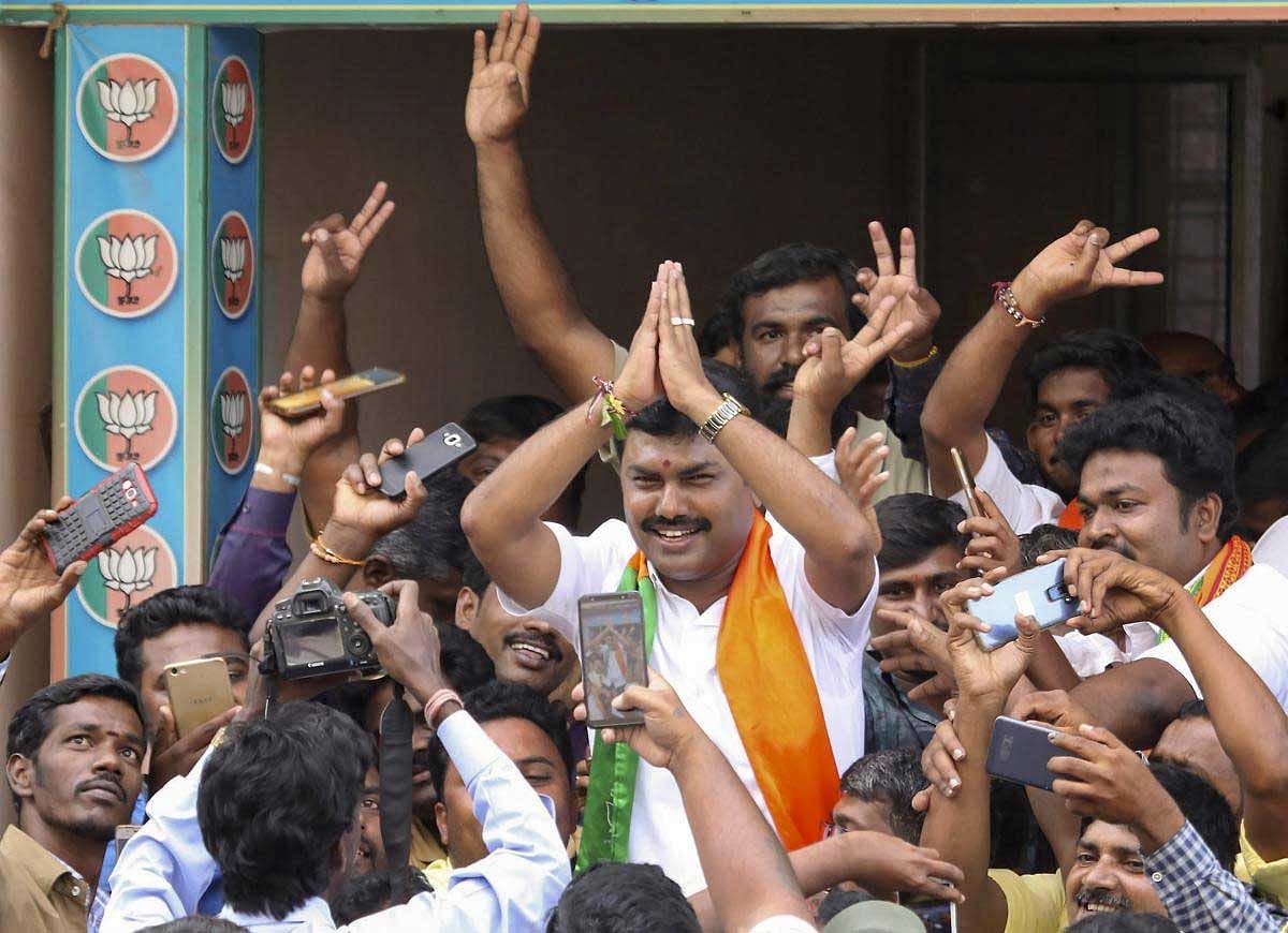  BJP candidate BY Raghavendra celebrates his victory in the Shimoga Lok Sabha by-poll, in Shivamogga, Karnataka, Tuesday, Nov. 6, 2018. (PTI Photo) 
