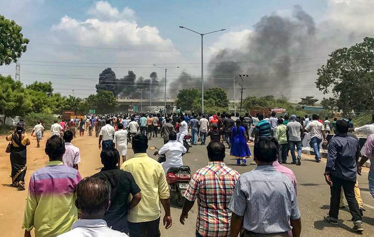 Smoke billows out of burning vehicles after a violent protest demanding the closure of Vedanta's Sterlite Copper unit, in Tuticorin. PTI file photo