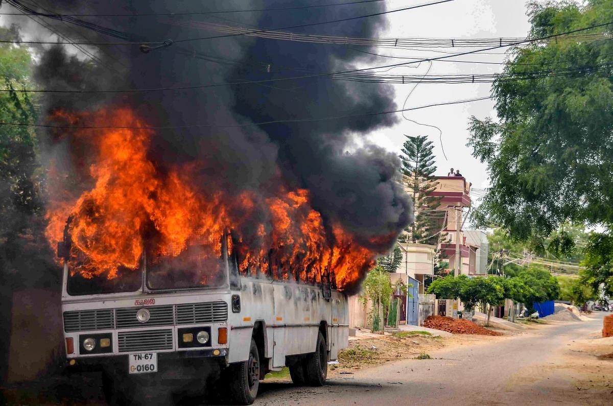 Tuticorin: Smoke billows from a buring bus during protests demanding the closure of Vedanta's Sterlite Copper unit, in Tuticorin, on Wednesday. In fresh violence today, one person was killed during the clash, after police's open fire killing at least ten