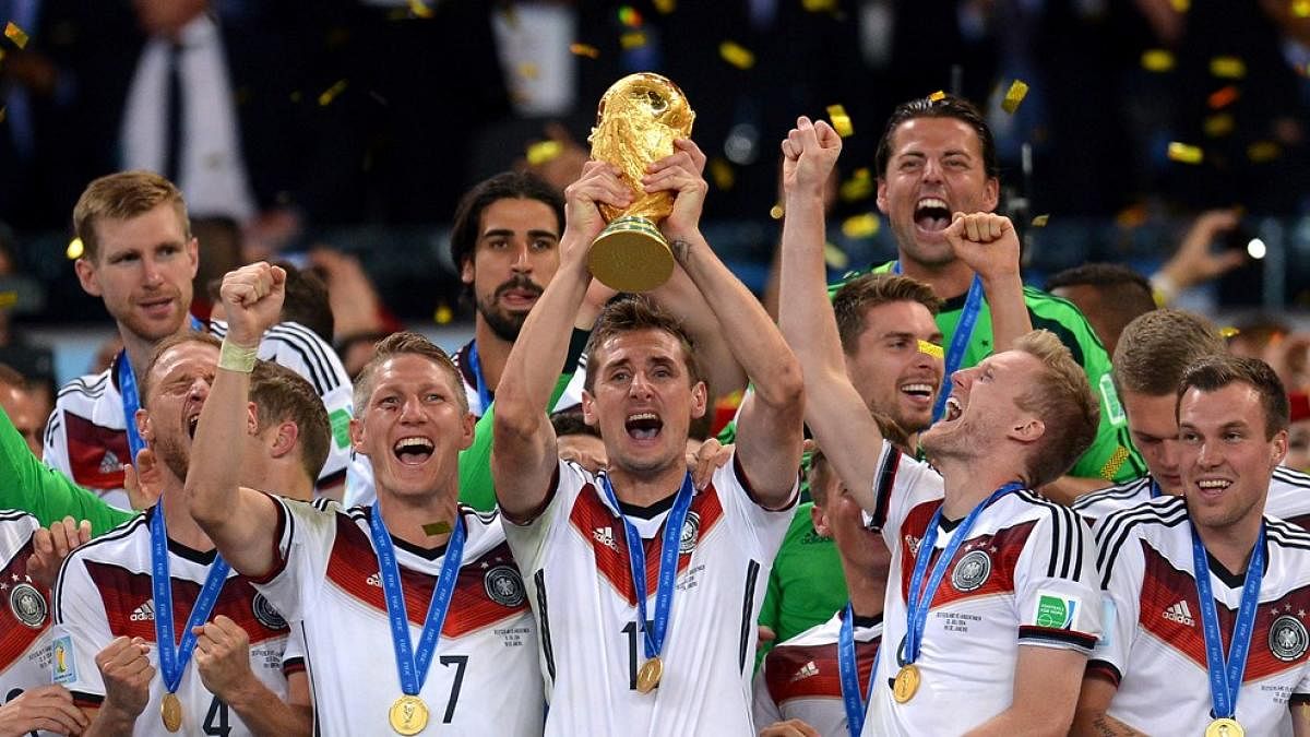 Germany celebrate with the World Cup trophy after beating Argentina in 2014 final.