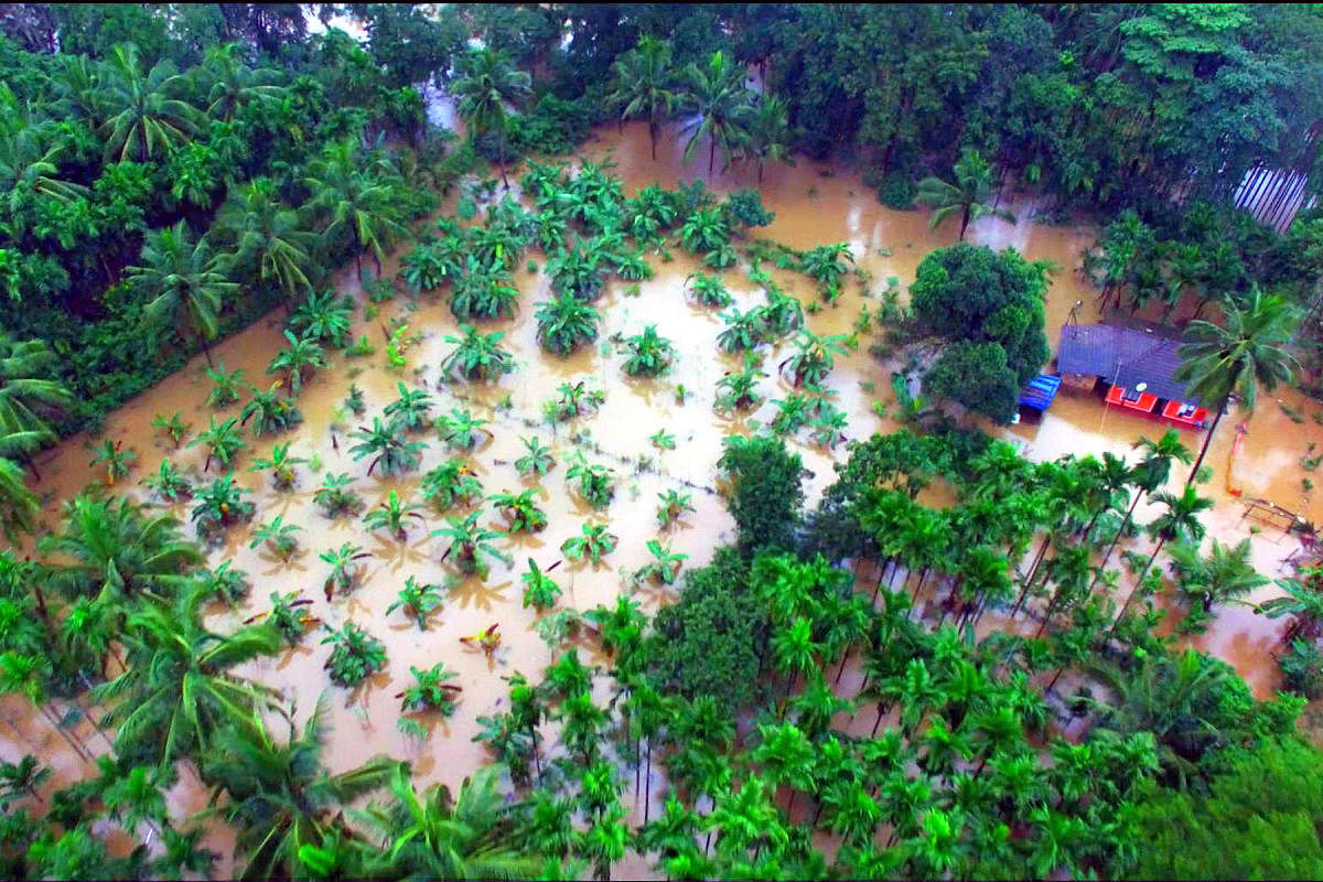 A view of a marooned house and farmland of Taniyappa Naika at Kulkunda Colony in Subrahmanya.