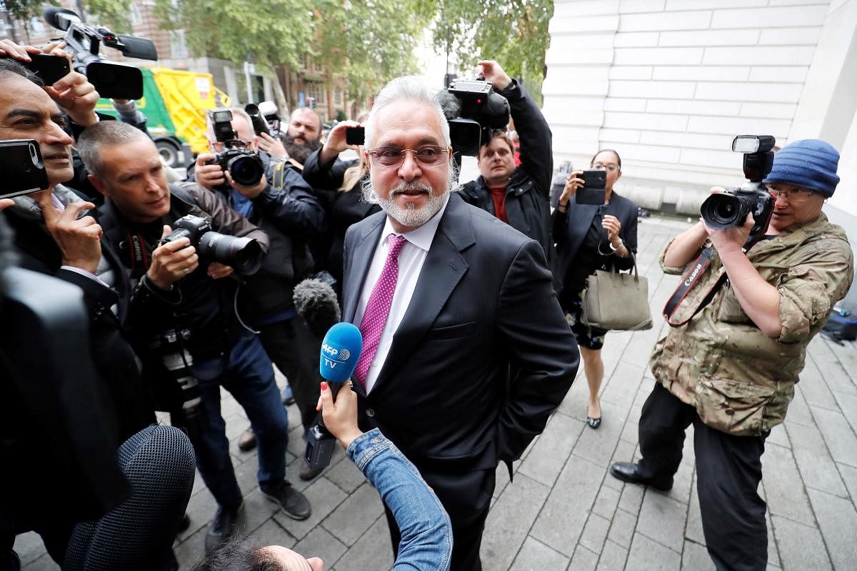 Tycoon Vijay Mallya speaks to the media as he arrives to appear at Westminster Magistrates Court in central London. AFP