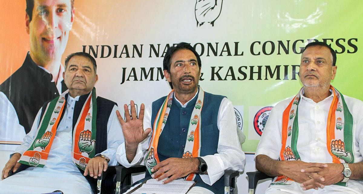 State Congress Chief Ghulam Ahmad Mir (C) addresses a press conference regarding elections, in Srinagar on Wednesday. Congress Party has decided to contest upcoming elections while National Conference and Peoples Democratic Party have boycotted. PTI